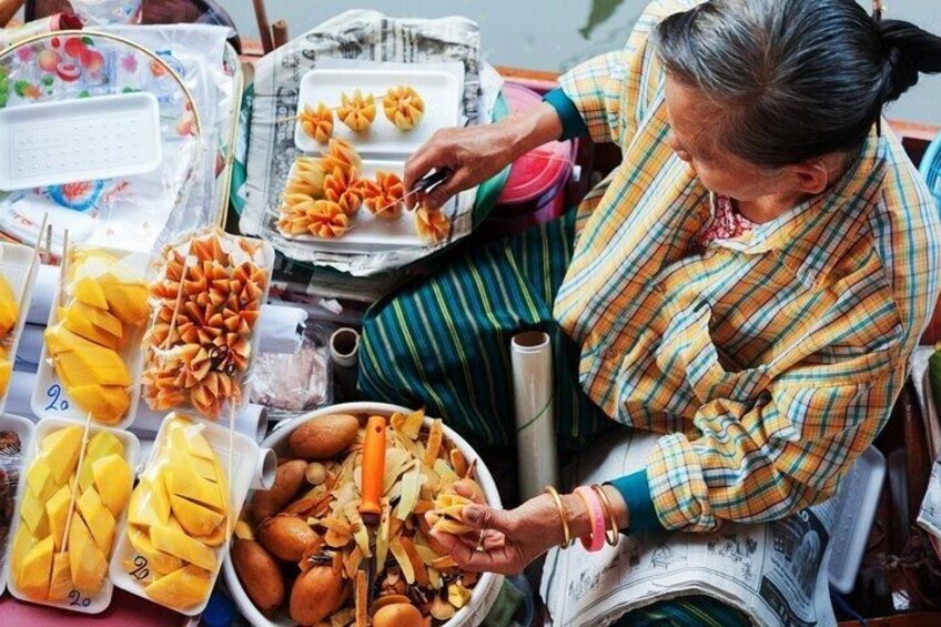 A person preparing food, with various dishes and ingredients visible. 3