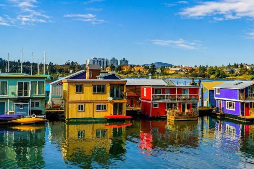 Colorful houses on stilts in a waterfront area. 1