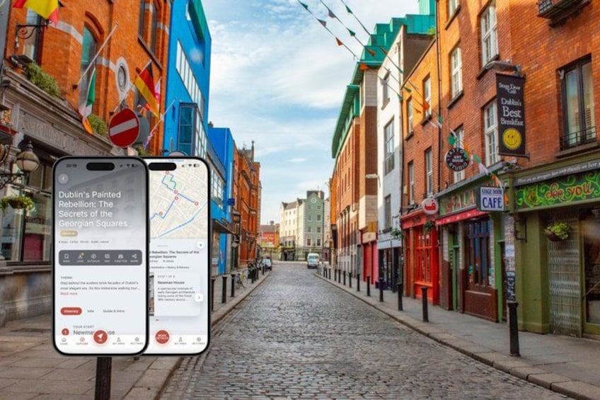 A cobblestone street lined with colorful buildings, a smartphone displaying a map, and a sign with a red circle and a white bar. 1
