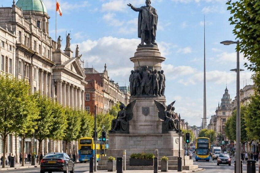 A statue of a historical figure on a pedestal, surrounded by trees and buildings. 3