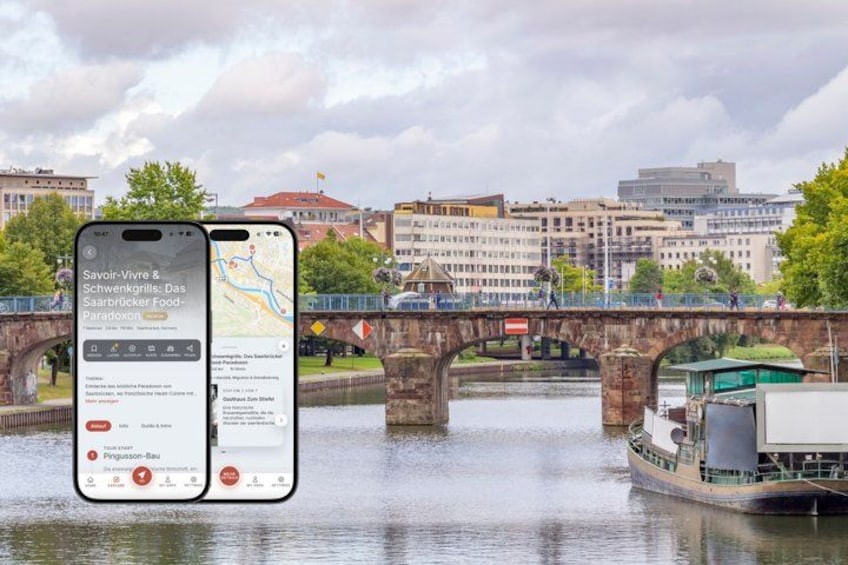 A smartphone displaying a map with a bridge and a boat in the background. 1