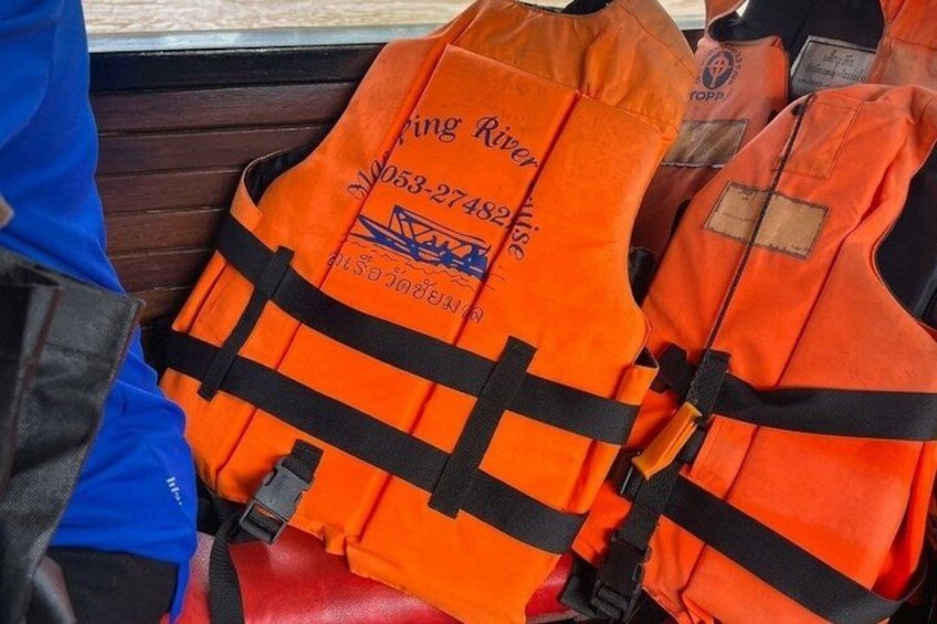 Orange life jackets with black straps and a logo. 3