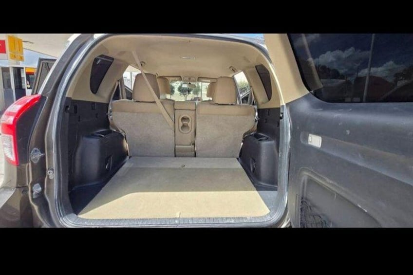 The interior of a car with a flat floor and two side speakers. 3