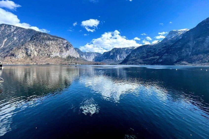 A calm lake with mountains in the background. 2
