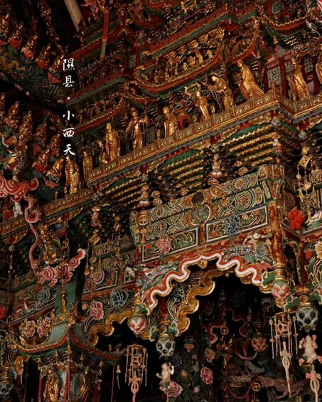 A richly decorated temple interior with intricate carvings and golden statues. 2
