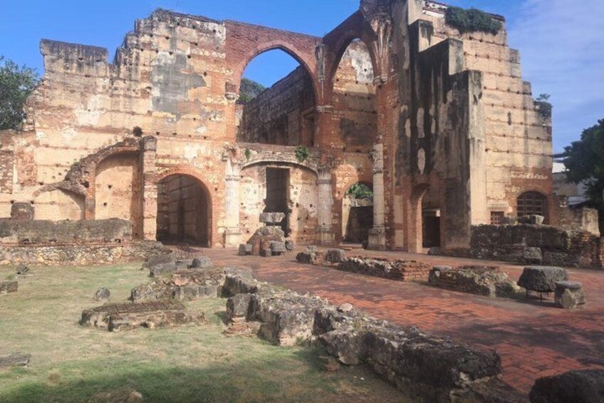 An ancient stone structure with arches and ruins. 4