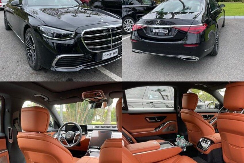 A black Mercedes-Benz with a visible license plate, and the interior features orange leather seats and a sunroof. 2