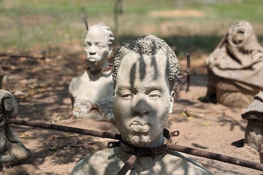 A collection of stone sculptures in an outdoor setting. 4
