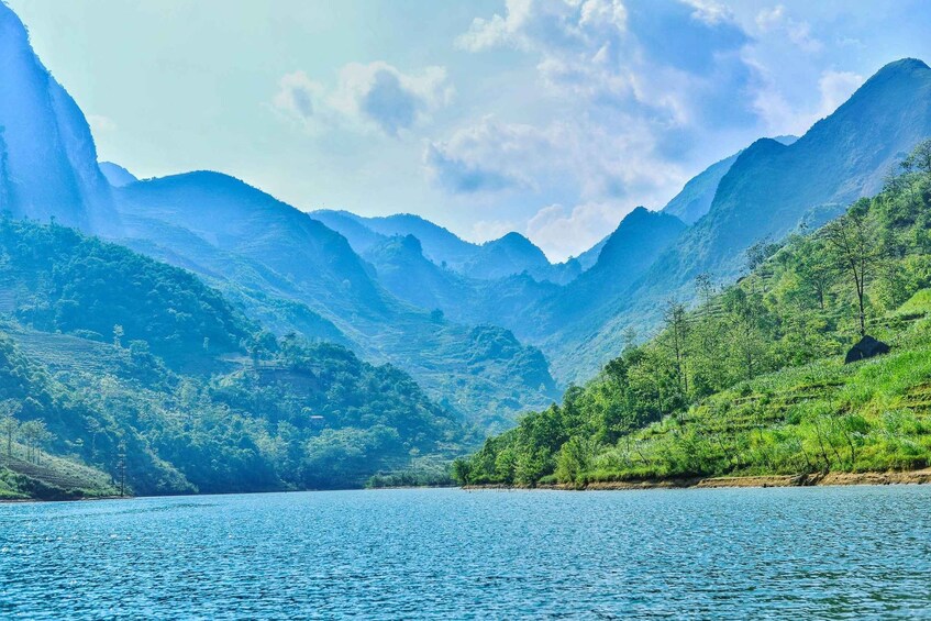 A mountainous landscape with a lake. 5