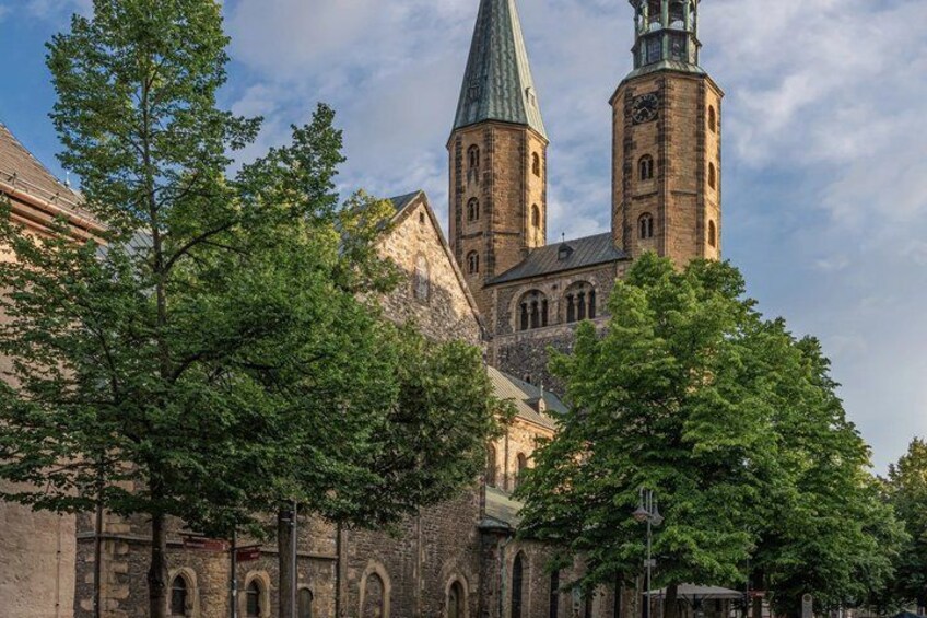 A historic church with a prominent tower and arched windows. 4