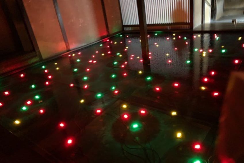 A floor with scattered multicolored lights. 3