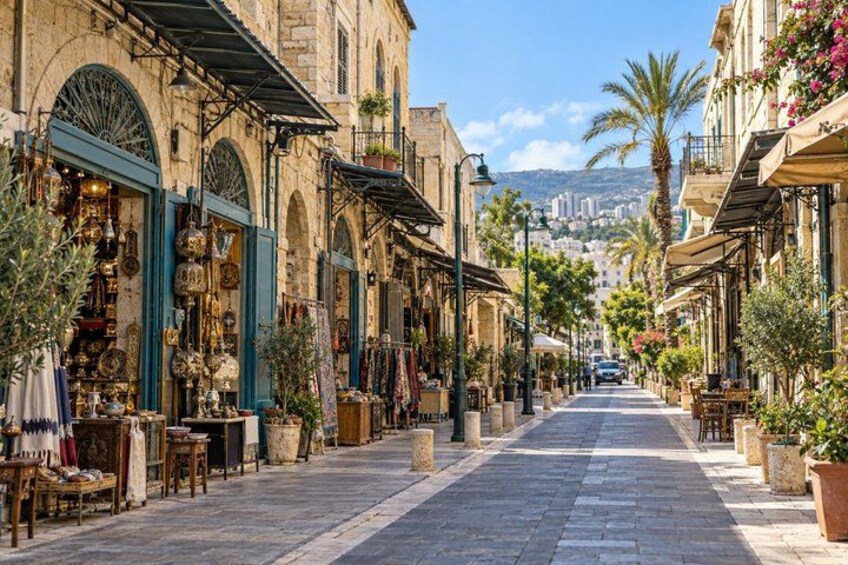 A street lined with shops and potted plants, with a clear view of the cityscape in the distance. 2