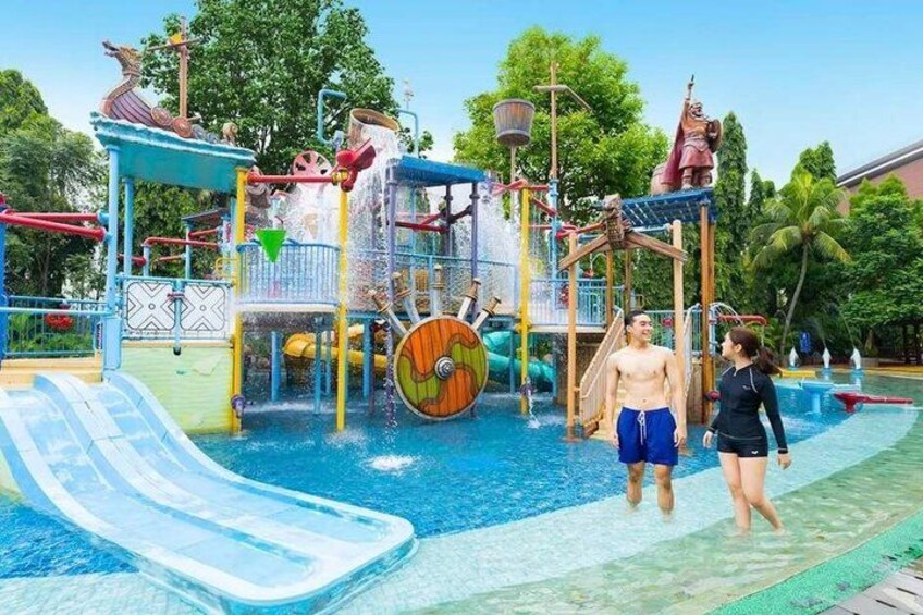 A water park with slides, a wave machine, and a pirate-themed play structure. 2