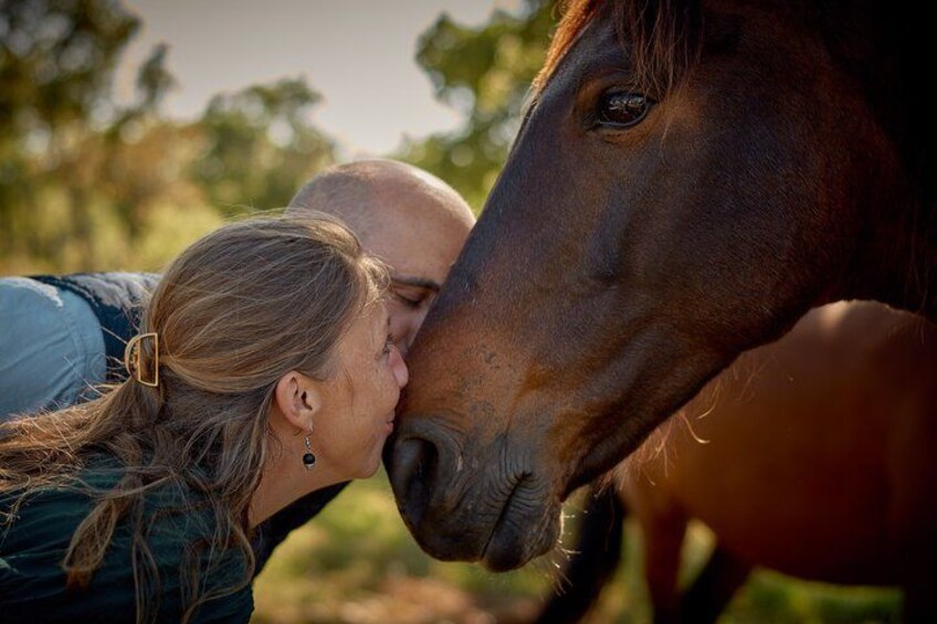 A person and a horse in a natural setting. 2