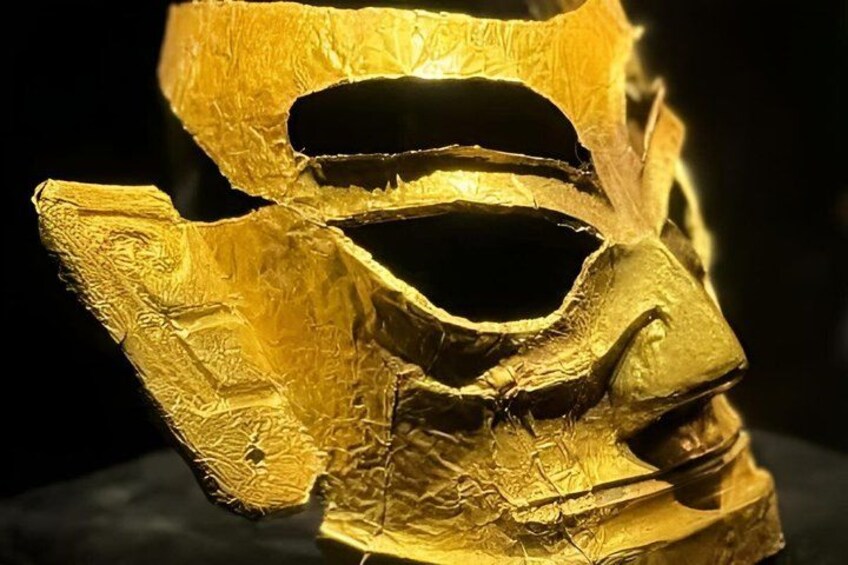 A golden artifact with intricate patterns and a central void. 2