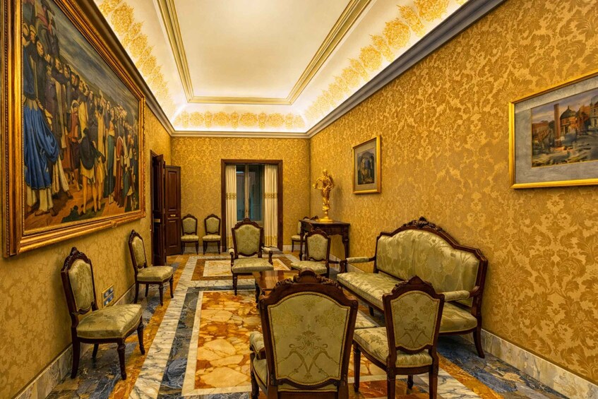 A grand hallway with ornate wallpaper, a large classical painting, and a marble floor. 2