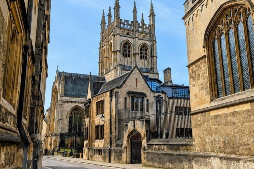 A historic building with Gothic architecture, including pointed arches and a large tower. 1