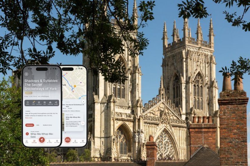 A historic cathedral with Gothic architecture, a smartphone displaying a map, and a sign with text. 1