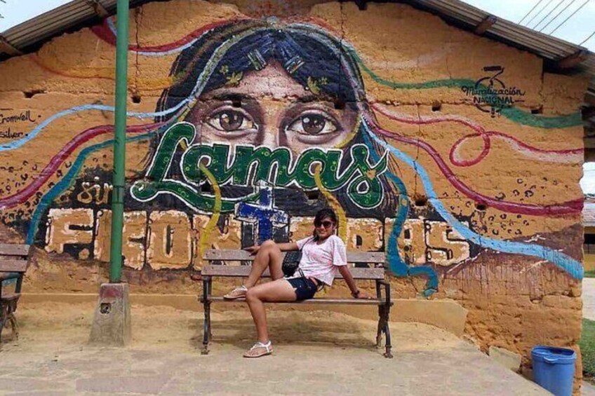 A mural with a face and the word 'Lamar' on a wall. 2