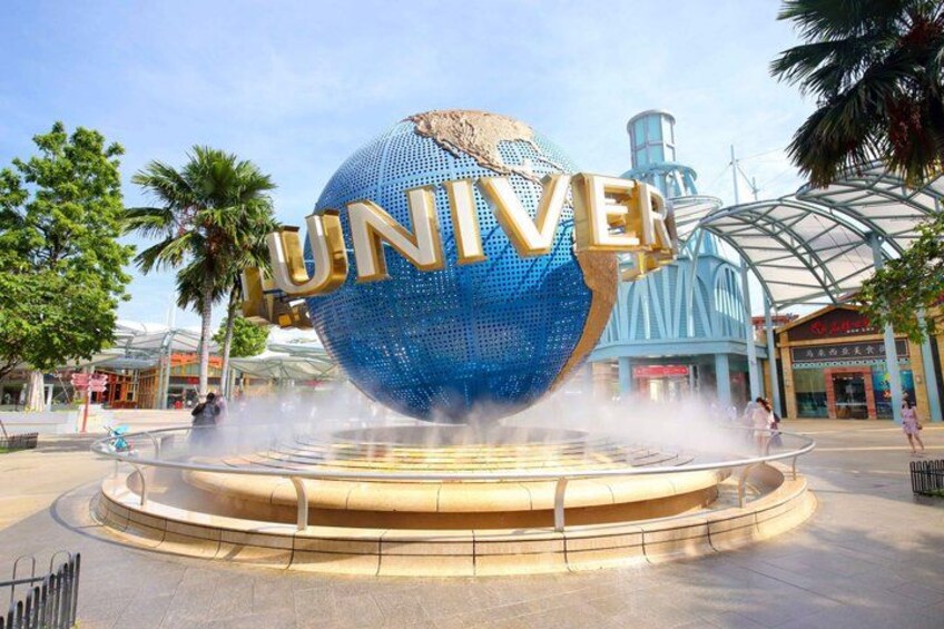 A large blue globe with the word 'UNIVER' and a water fountain in the foreground. 1