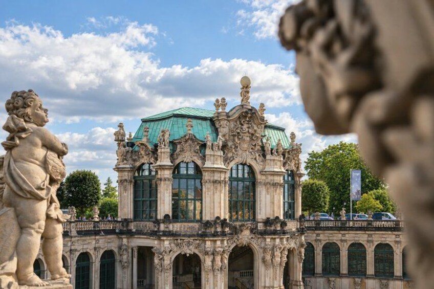 A historic building with ornate architecture, including statues and intricate details. 2