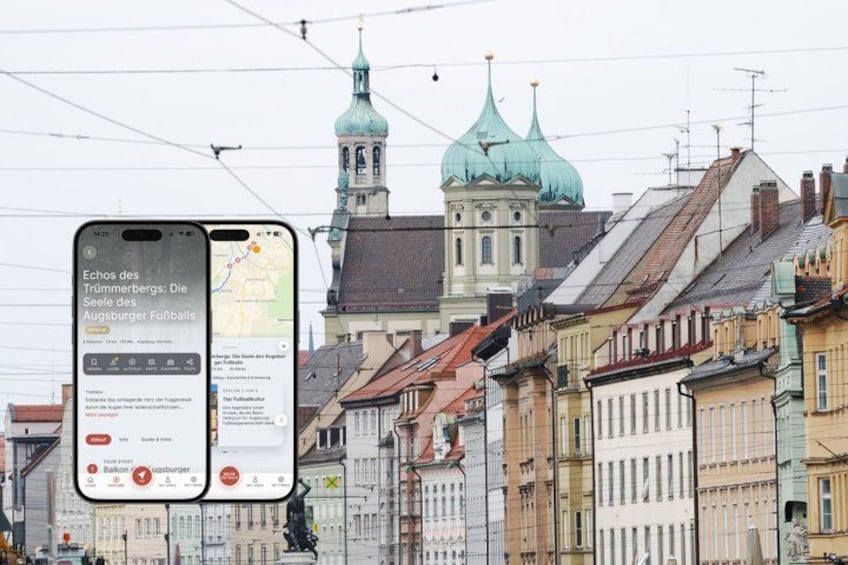 A smartphone displaying a map with a location marker, a historic building with green domes, and a row of traditional buildings. 1
