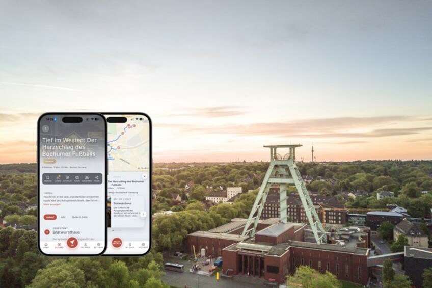 A smartphone displaying a map with a mining structure in the background. 1