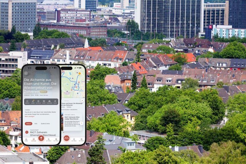 A smartphone displaying a map with text in German, a cityscape with red-roofed houses, and modern buildings in the background. 1