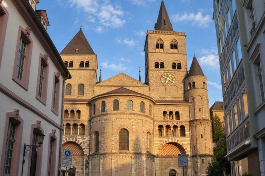 A historic church with a prominent clock tower and arched windows. 5