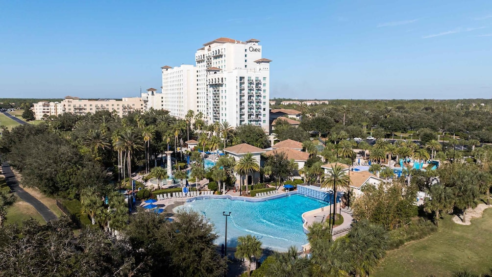 A resort with a large pool, palm trees, and a high-rise building labeled 'OMNI'. 4