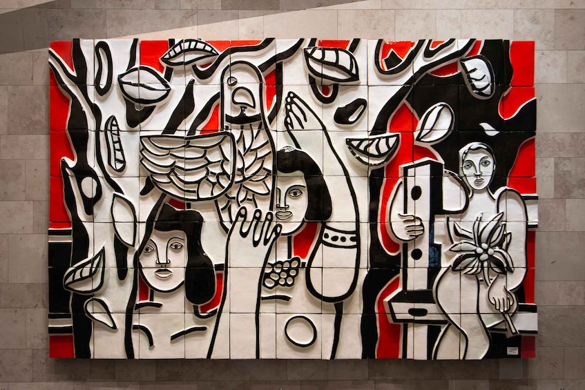 A large abstract mural with geometric shapes and figures in black, white, and red. 1