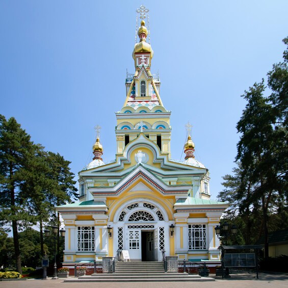 A colorful church with a golden dome and intricate designs. 3