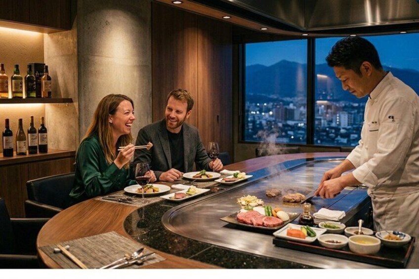 A high-end restaurant with a chef preparing food at a hot plate. 4