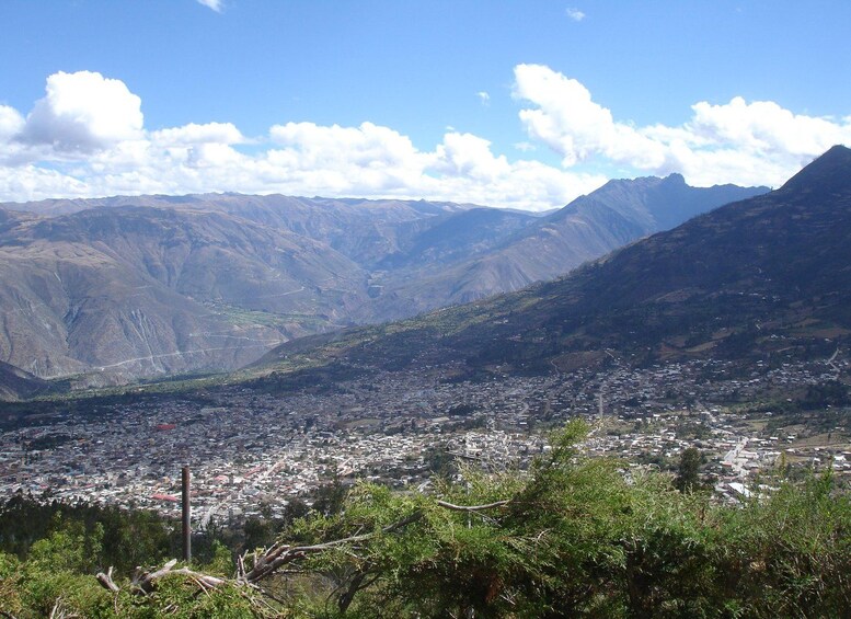 A mountainous landscape with a valley city. 2