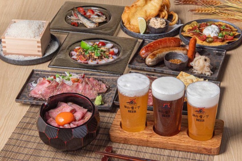 A variety of dishes and drinks, including fish, sausages, and beer, arranged on a wooden table. 1