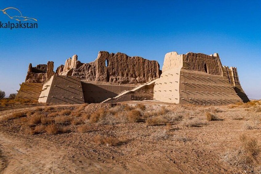 Ancient ruins with a large pyramid-like structure and a staircase leading up to it. 3