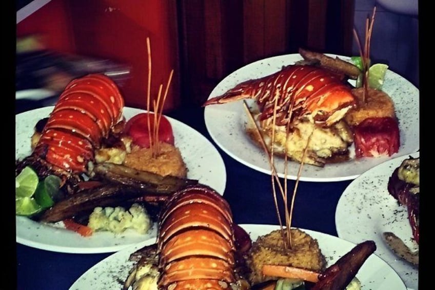 Lobster dishes on plates with toothpicks. 5