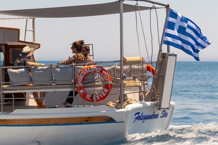 A boat named 'Folegandros Star' with a lifebuoy and a Greek flag. 4