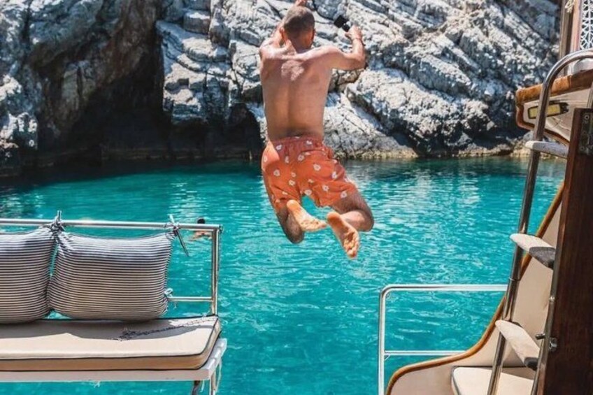 A person jumping into a pool from a boat. 5
