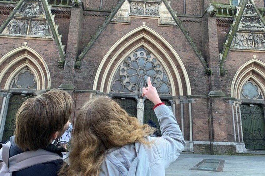 A historic building with pointed arches and intricate stonework. 2