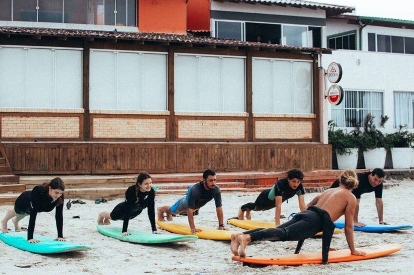 A group of people on surfboards at a beach. 4