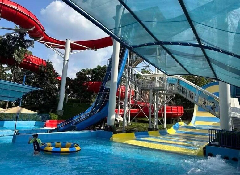 A water park with multiple water slides and a pool area. 3