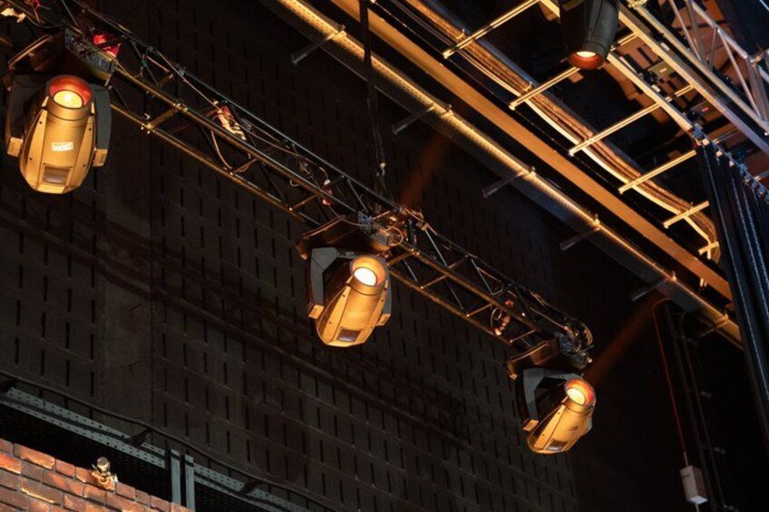 Streetlights against a brick building. 2