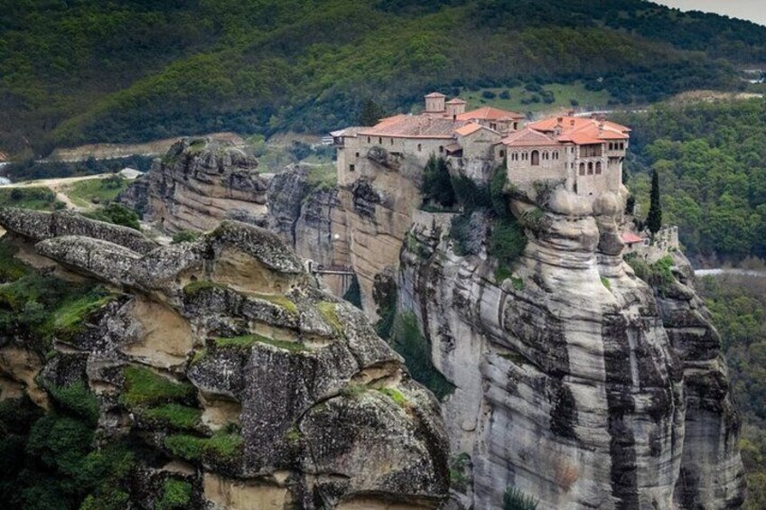 A castle perched atop a rocky cliff. 5