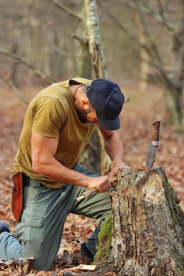 A person chopping wood with an axe. 2