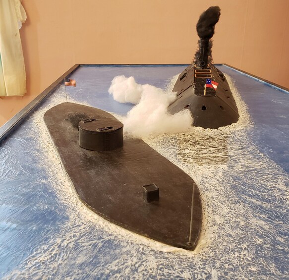 A model ship with a flag, a smokestack, and a funnel. 2