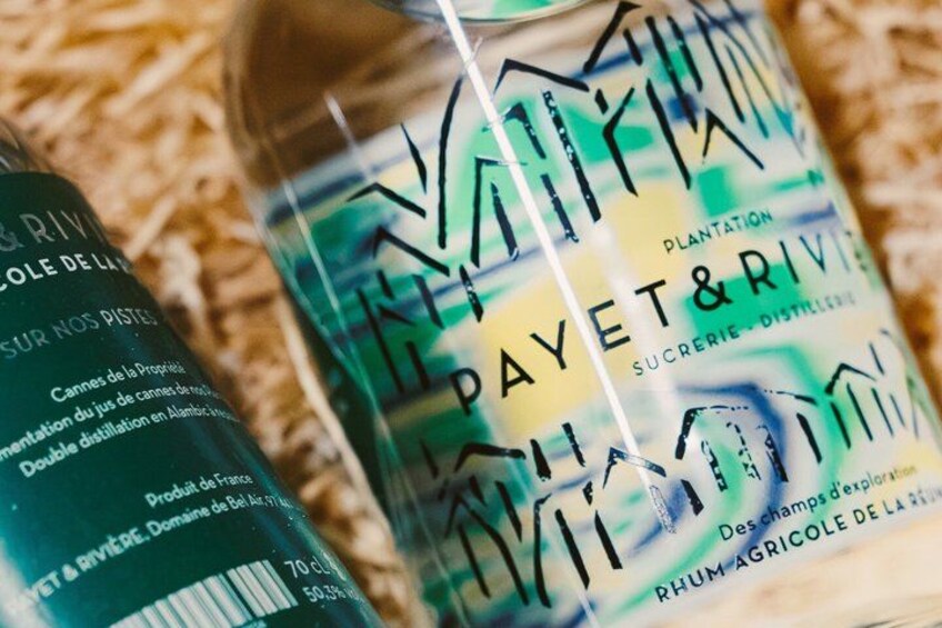 A bottle of Payet & Rivie sugarcane syrup with a colorful label. 2