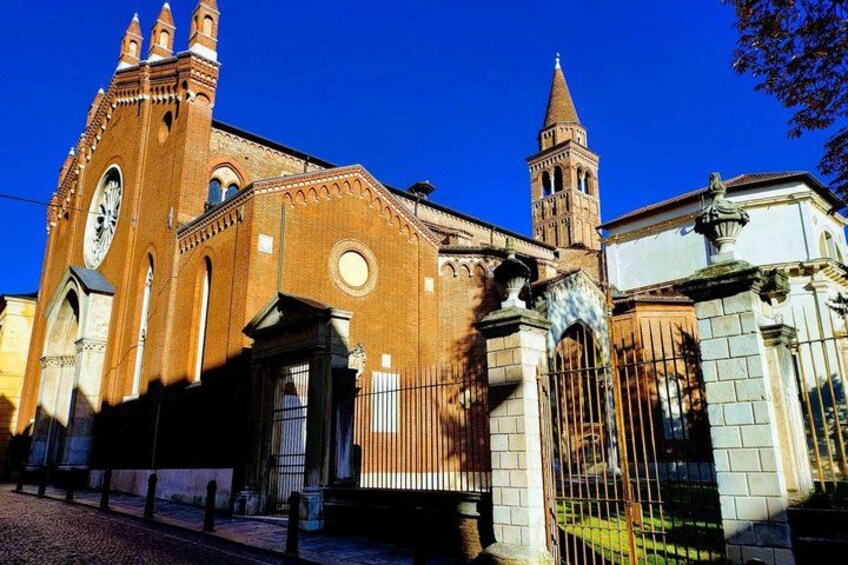 A historic church with a clock tower and a tall bell tower. 3