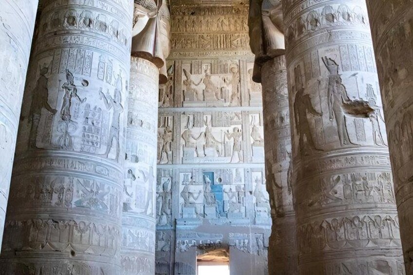 Ancient Egyptian temple columns with hieroglyphic carvings. 2