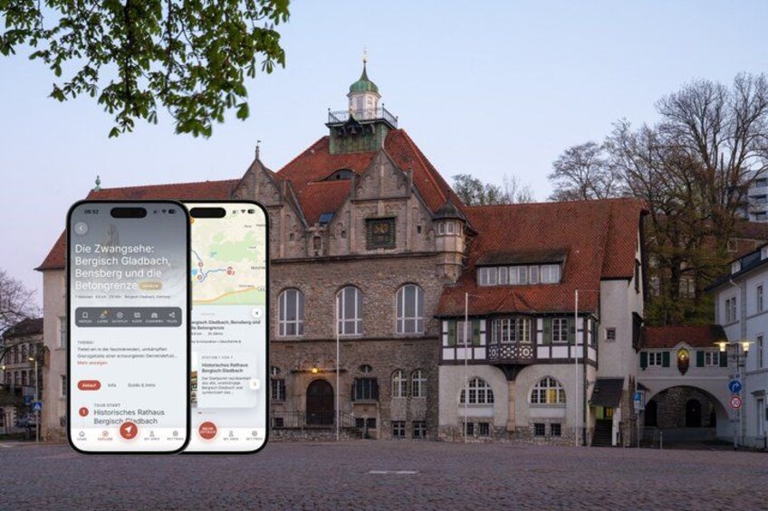 A historic building with a clock tower, a cobblestone street, and a smartphone displaying a map. 1
